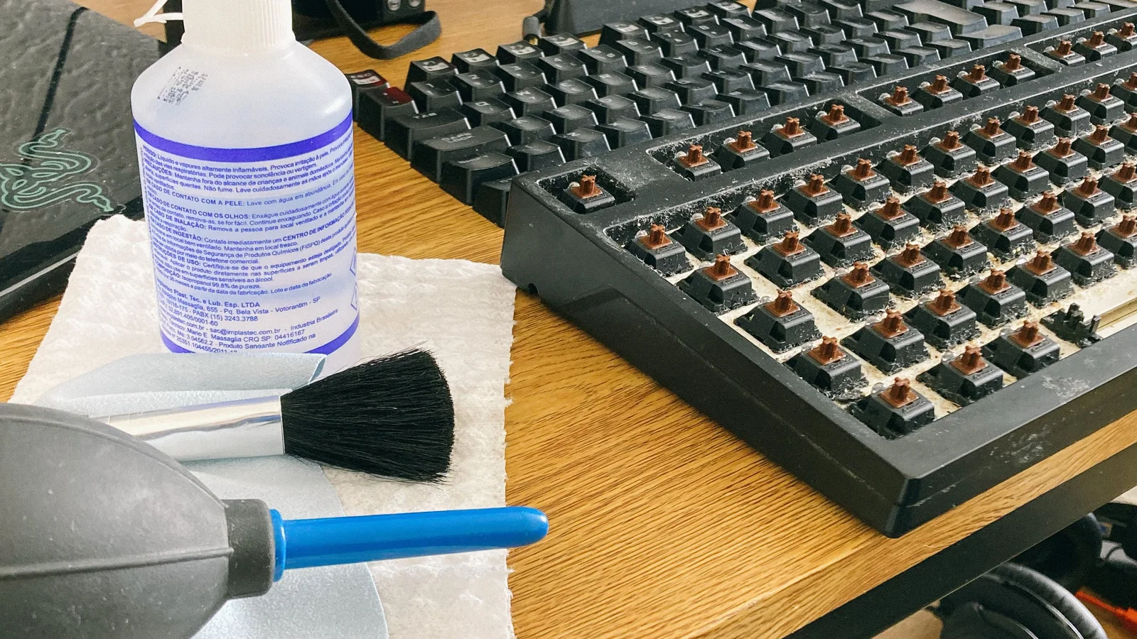 Black keyboard on a desk ready to be cleaned
