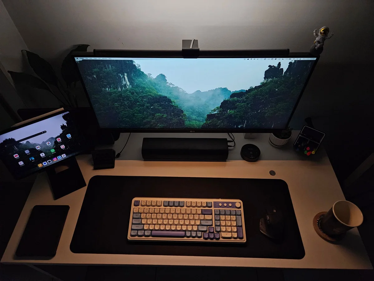 Top view of a centered keyboard with the mouse kept close on the same desk surface