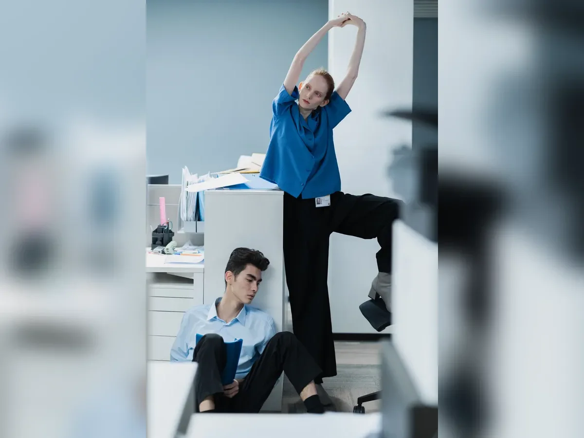 Office workers changing position and stretching during a movement break