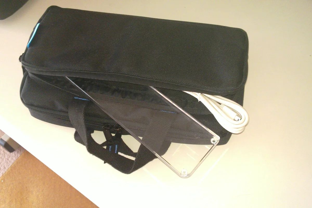 Fitted hard keyboard case with an acrylic wrist rest and USB cable