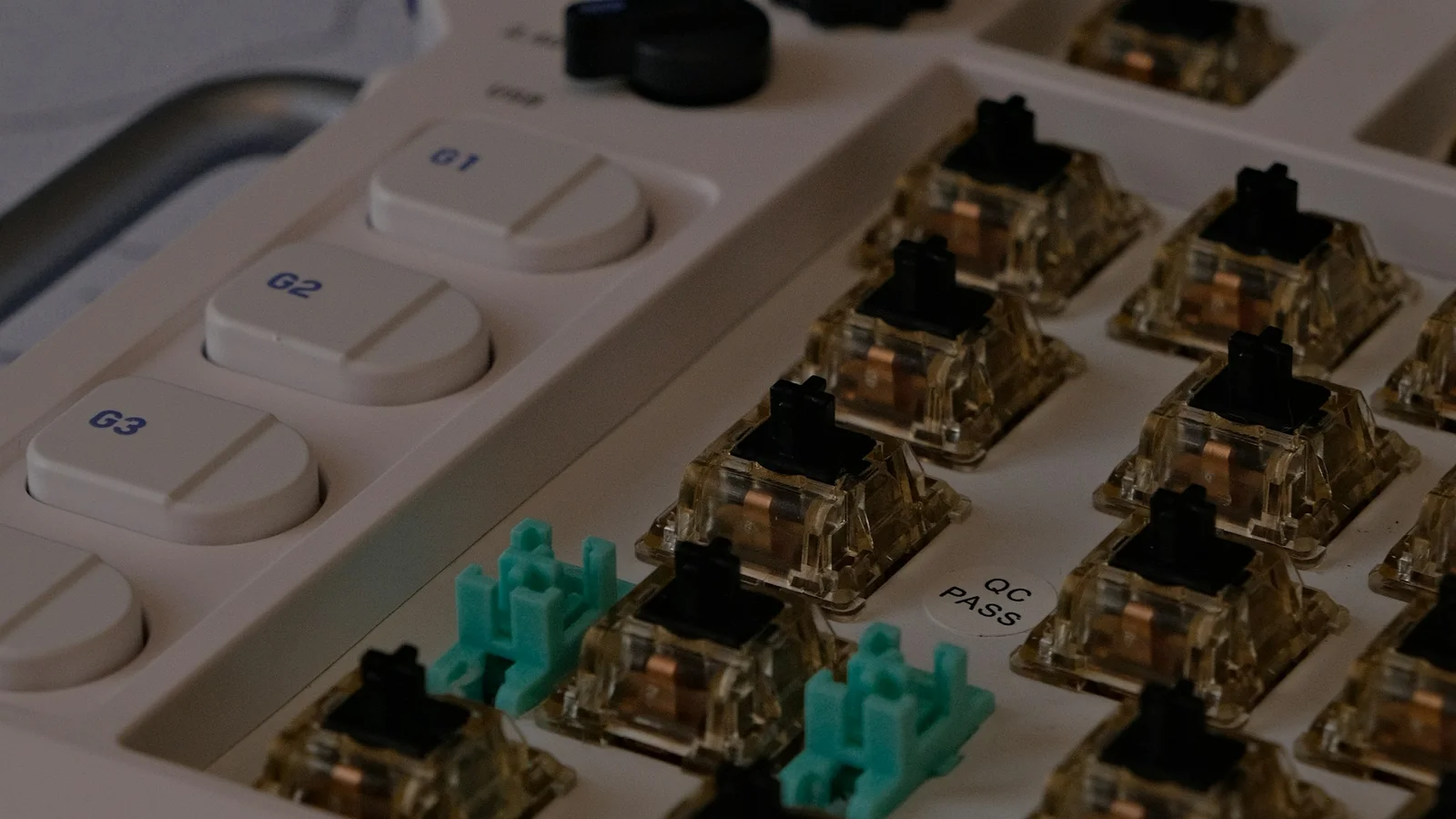 Close-up of exposed mechanical keyboard switches beneath removed keycaps