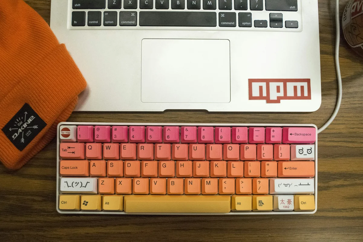 A compact keyboard fitted with a documented colorful PBT keycap set