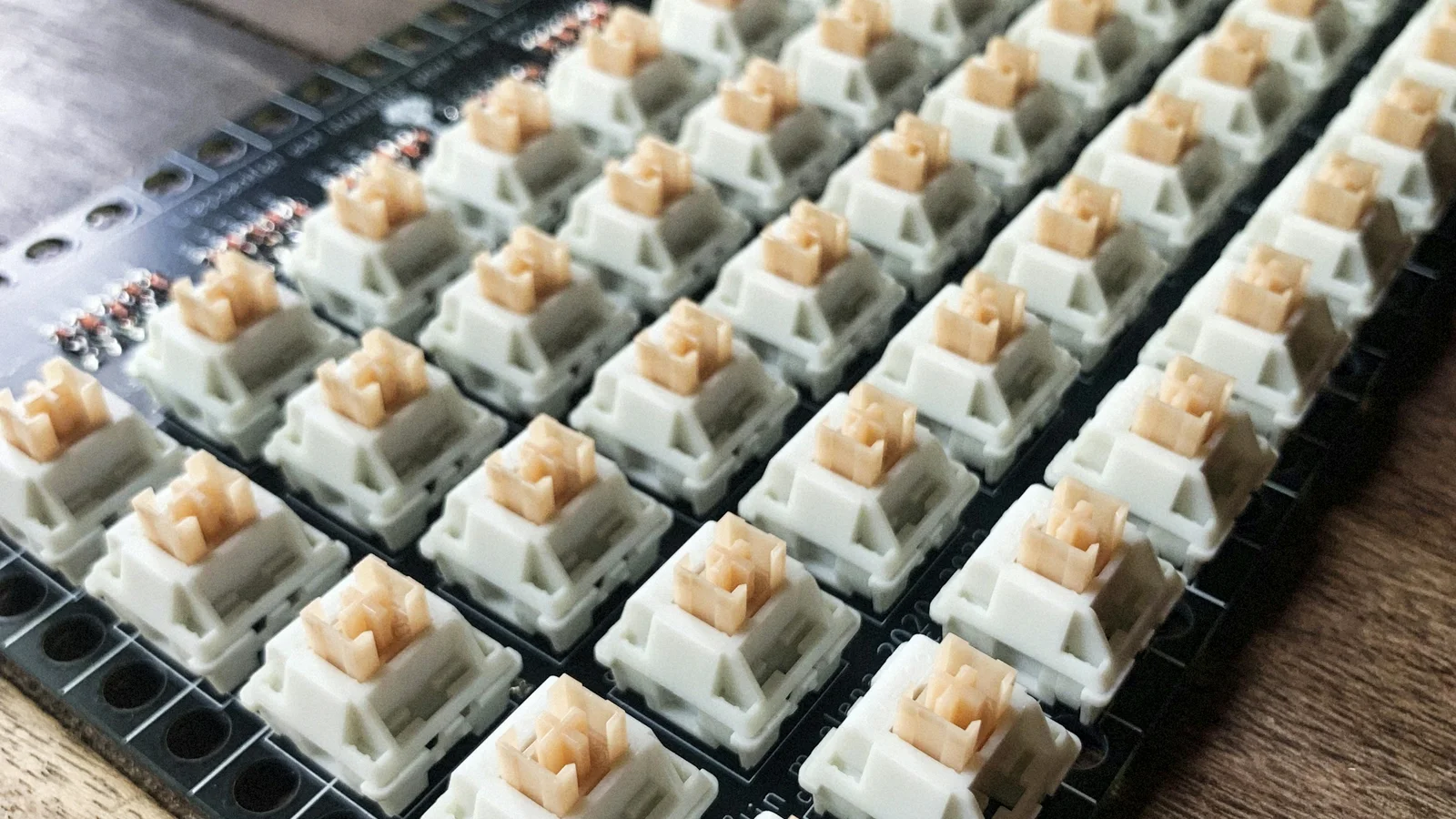 Grid of assorted mechanical keyboard switches arranged for comparison