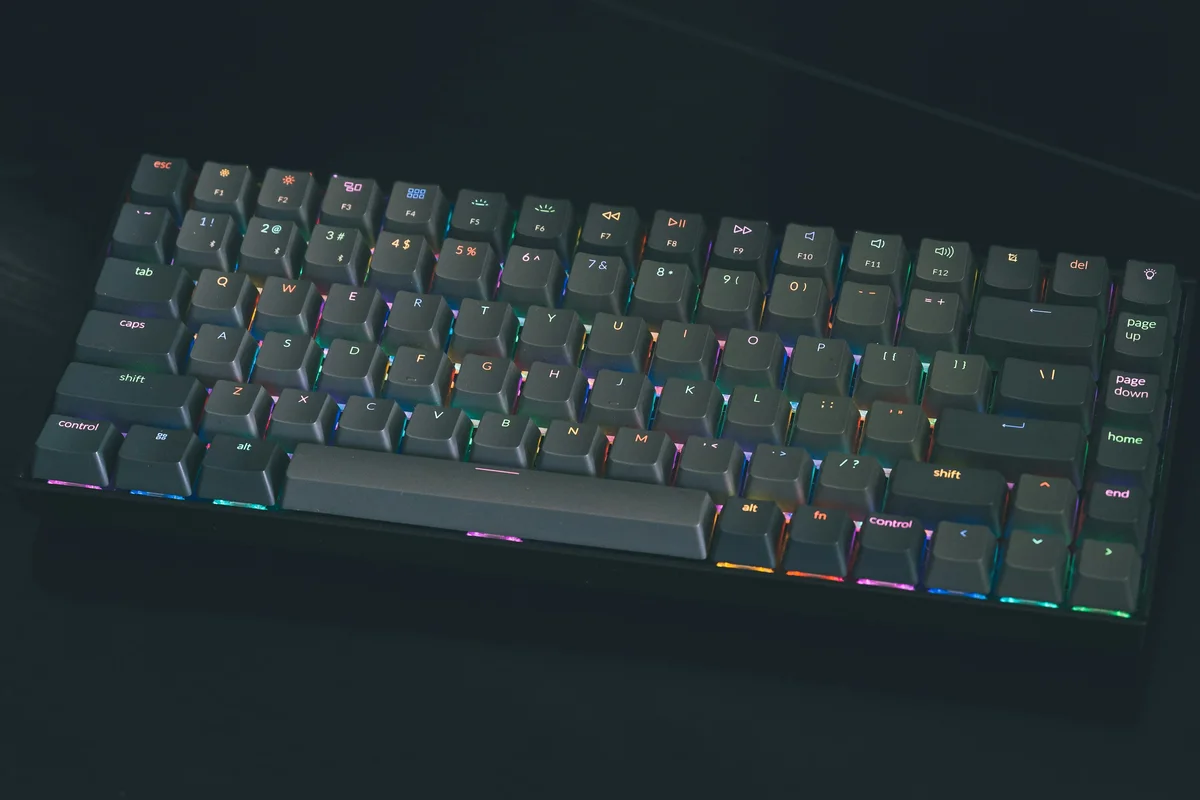 Mechanical keyboard showing different RGB colors across individual key positions